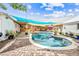 Expansive backyard featuring a pool, patio, and lounge areas with sunshades for a perfect outdoor living space at 3126 N 17Th Dr, Phoenix, AZ 85015