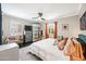 Comfortable bedroom with ceiling fan, plantation shutters, large bed, and calming decor with neutral wall color at 3126 N 17Th Dr, Phoenix, AZ 85015