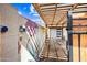 Side entrance featuring a colorful mural and pergola covered driveway at 3126 N 17Th Dr, Phoenix, AZ 85015