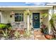 Inviting front porch featuring potted plants, a seating area, and a decorative wreath at 3126 N 17Th Dr, Phoenix, AZ 85015