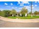 Charming single-story home featuring a lush green lawn, mature trees, and a welcoming facade at 3126 N 17Th Dr, Phoenix, AZ 85015