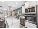 Updated eat-in kitchen with stainless appliances, a large island, and open to the dining area at 3126 N 17Th Dr, Phoenix, AZ 85015