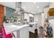 Bright kitchen with stainless steel appliances, quartz countertops, and bold backsplash at 3126 N 17Th Dr, Phoenix, AZ 85015