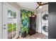 Laundry room with patterned floors and stacked washer and dryer at 3126 N 17Th Dr, Phoenix, AZ 85015