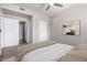 Comfortable bedroom featuring plush bedding, a ceiling fan, and bright, neutral paint at 3302 N 7Th St # 108, Phoenix, AZ 85014