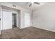 Bedroom with neutral walls, ceiling fan, and access to bathroom and closet at 3302 N 7Th St # 108, Phoenix, AZ 85014