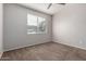 Cozy carpeted bedroom with a ceiling fan and natural light from the window at 3302 N 7Th St # 108, Phoenix, AZ 85014