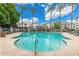 Large community pool with multiple lounge chairs and a shaded seating area at 3302 N 7Th St # 108, Phoenix, AZ 85014