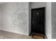 A solid black front door with the number 108 in a tan stucco entryway, welcoming visitors at 3302 N 7Th St # 108, Phoenix, AZ 85014