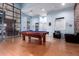 Spacious game room featuring a billiard table, comfortable seating, and ample natural light at 3302 N 7Th St # 108, Phoenix, AZ 85014