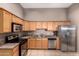 Well-equipped kitchen featuring stainless steel appliances and granite countertops at 3302 N 7Th St # 108, Phoenix, AZ 85014