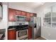 Efficient kitchen with stainless steel appliances and ample cabinet space for modern cooking convenience at 3302 N 7Th St # 108, Phoenix, AZ 85014