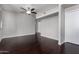 Spacious living room boasts dark hardwood floors and modern ceiling fan for comfortable living at 3302 N 7Th St # 108, Phoenix, AZ 85014