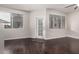 Bright living room boasts hardwood floors and multiple windows, providing ample natural light at 3302 N 7Th St # 108, Phoenix, AZ 85014
