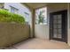 View of the patio featuring a privacy wall and door to the outdoors at 3302 N 7Th St # 108, Phoenix, AZ 85014