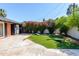 Well-maintained backyard with new lawn game area and beautiful plants at 3514 N 83Rd St, Scottsdale, AZ 85251