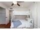 Bedroom with bunkbeds, wood floors, and white trim at 3514 N 83Rd St, Scottsdale, AZ 85251