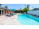 Beautiful outdoor area with pristine pool, lounge chairs, and charming landscaping at 3514 N 83Rd St, Scottsdale, AZ 85251