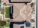 A high aerial view showcases the roof of the property, along with its grassy backyard at 4330 W Aracely Dr, New River, AZ 85087