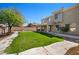 Well-maintained backyard with lush green grass and mature trees, perfect for outdoor entertaining at 4330 W Aracely Dr, New River, AZ 85087