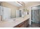 Bathroom showcasing dual sinks, modern fixtures, and tile flooring, offering comfort and convenience at 4330 W Aracely Dr, New River, AZ 85087