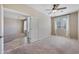 Bright bedroom featuring a ceiling fan, neutral walls, and plush carpeting at 4330 W Aracely Dr, New River, AZ 85087