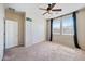 Neutral bedroom featuring carpet, ceiling fan, and closet at 4330 W Aracely Dr, New River, AZ 85087