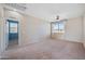 Relaxing bedroom with plush carpet, ceiling fan, and view to the outside at 4330 W Aracely Dr, New River, AZ 85087