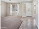 Bright entryway featuring tile flooring and a front door with decorative glass at 4330 W Aracely Dr, New River, AZ 85087