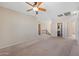 Spacious living room with plush carpet and views to the kitchen and staircase at 4330 W Aracely Dr, New River, AZ 85087