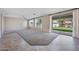 Spacious living room with neutral walls and plush carpeting with large windows and sliding glass door at 4330 W Aracely Dr, New River, AZ 85087