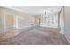 Comfortable living room featuring built-in shelving and access to other rooms at 4330 W Aracely Dr, New River, AZ 85087