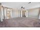 Spacious main bedroom with neutral colors and plush carpet, leading to the ensuite bath at 4330 W Aracely Dr, New River, AZ 85087