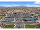 Aerial view of the community center, showing tennis courts, clubhouse, and parking at 4515 E Rakestraw Ln, Gilbert, AZ 85298