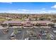 Aerial view of the community clubhouse, parking area, and lush landscaping at 4515 E Rakestraw Ln, Gilbert, AZ 85298