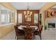 Dining room with a round table, decorative chairs, and large windows that let in light at 4515 E Rakestraw Ln, Gilbert, AZ 85298