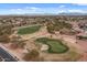 Aerial view of the golf course showing putting green and surrounding homes at 4515 E Rakestraw Ln, Gilbert, AZ 85298