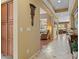 Hallway with tile and hardwood floors offering views into the living area at 4515 E Rakestraw Ln, Gilbert, AZ 85298