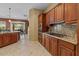Beautiful kitchen featuring a central island, granite countertops, and modern appliances at 4515 E Rakestraw Ln, Gilbert, AZ 85298