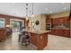 Open kitchen featuring an island with bar seating, granite countertops, and stainless steel appliances at 4515 E Rakestraw Ln, Gilbert, AZ 85298