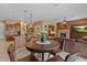 Inviting breakfast nook, kitchen and living area with tile floors at 4515 E Rakestraw Ln, Gilbert, AZ 85298