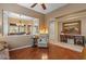 Bright living room with hardwood floors, shutters, view to the dining room, and an elegant seating area at 4515 E Rakestraw Ln, Gilbert, AZ 85298