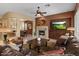 Inviting living room features a fireplace and beautiful wood accents at 4515 E Rakestraw Ln, Gilbert, AZ 85298