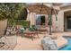 Tranquil pool area with lounge chairs and lush landscaping, offering a peaceful retreat at 4515 E Rakestraw Ln, Gilbert, AZ 85298