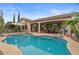 Beautiful pool showcasing the outdoor covered patio and lounge areas for ultimate relaxation at 4515 E Rakestraw Ln, Gilbert, AZ 85298