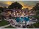 Stunning aerial view of an estate home with a sprawling pool, lush landscaping, and unique outdoor features at 5040 N Arcadia Dr, Phoenix, AZ 85018