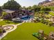 Lush backyard featuring a large lawn, seating areas, multiple entertaining spaces, mountain views, and outdoor recreation at 5040 N Arcadia Dr, Phoenix, AZ 85018