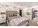 Bedroom featuring floral wallpaper, a tufted headboard, and coordinated bedding creating a warm and inviting atmosphere at 5040 N Arcadia Dr, Phoenix, AZ 85018