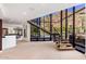 Spacious entryway with natural light and walls of glass looking out on a resort style backyard at 5040 N Arcadia Dr, Phoenix, AZ 85018