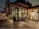 Exterior home view showcasing a wooden deck with seating, large windows, and inviting backyard ambiance at 5040 N Arcadia Dr, Phoenix, AZ 85018